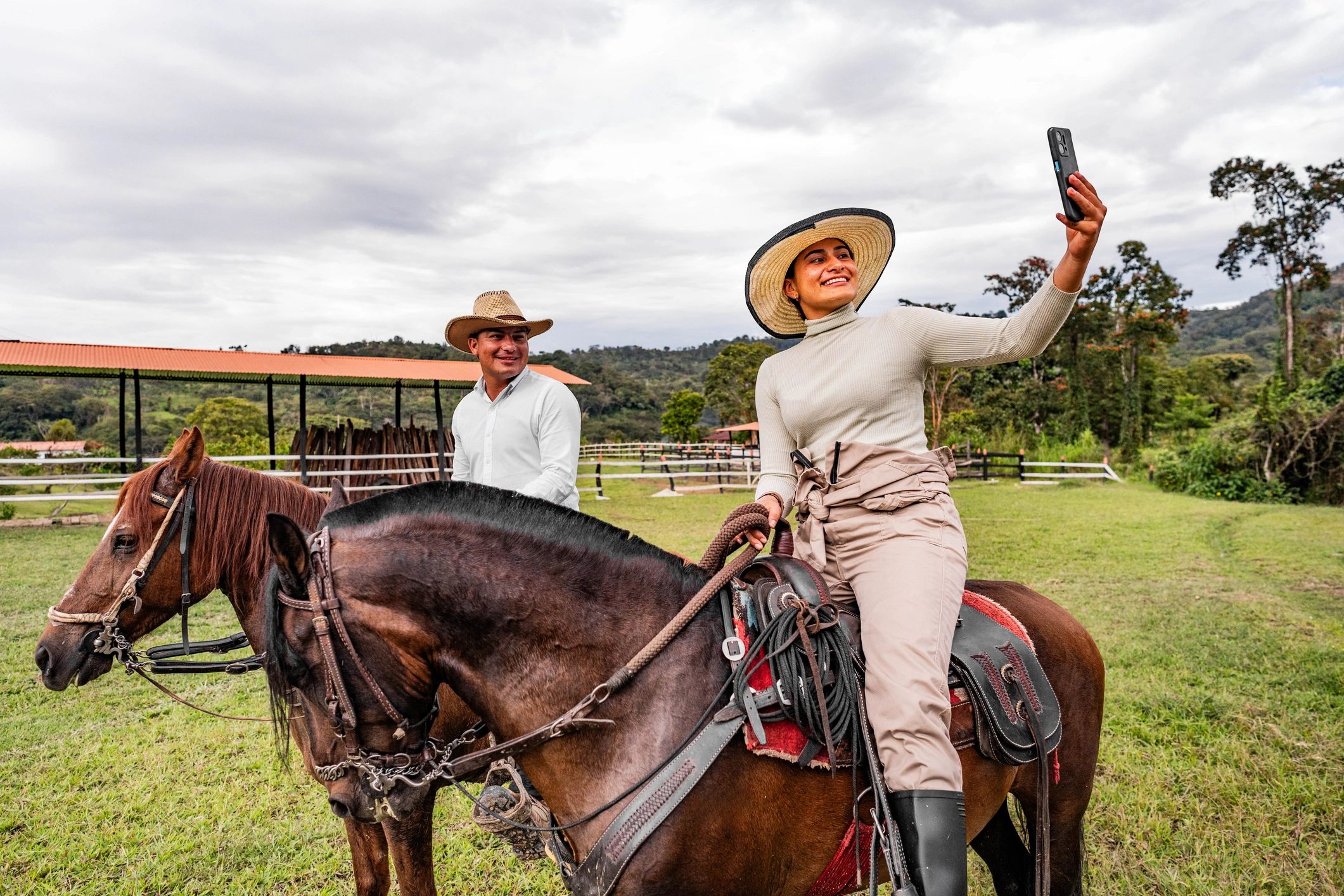 Two friends at a ranch taking a selfie